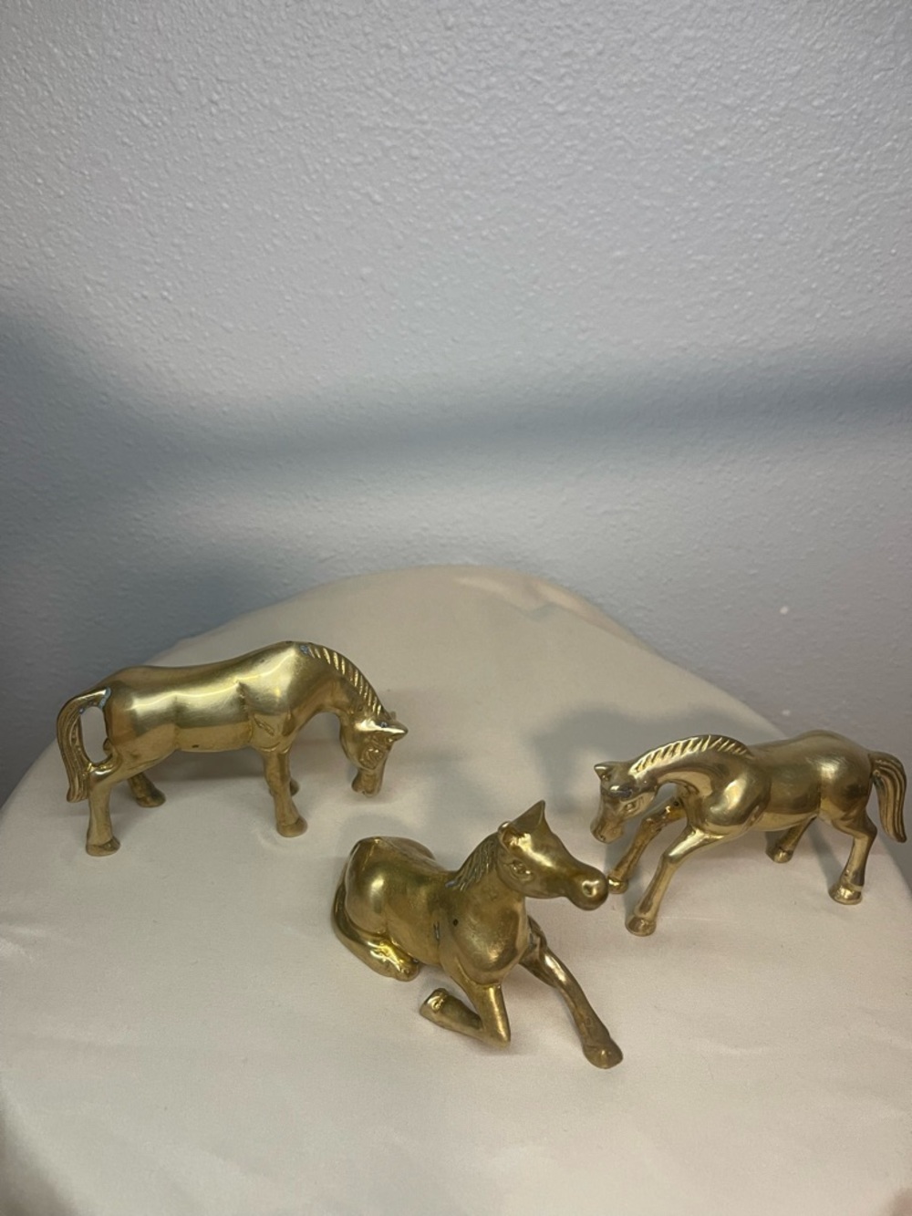 Brass horses figurines of Three